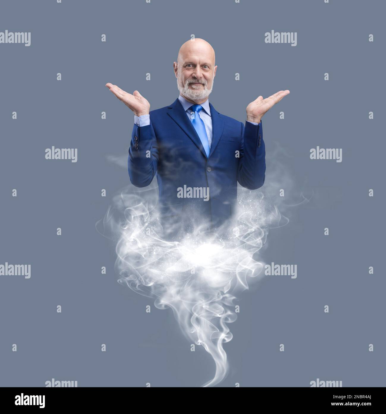 Businessman genie appearing and smoke, he is smiling and fulfilling wishes Stock Photo