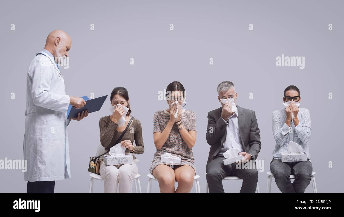 Sick people with cold and flu sitting in the waiting room at the hospital and blowing their