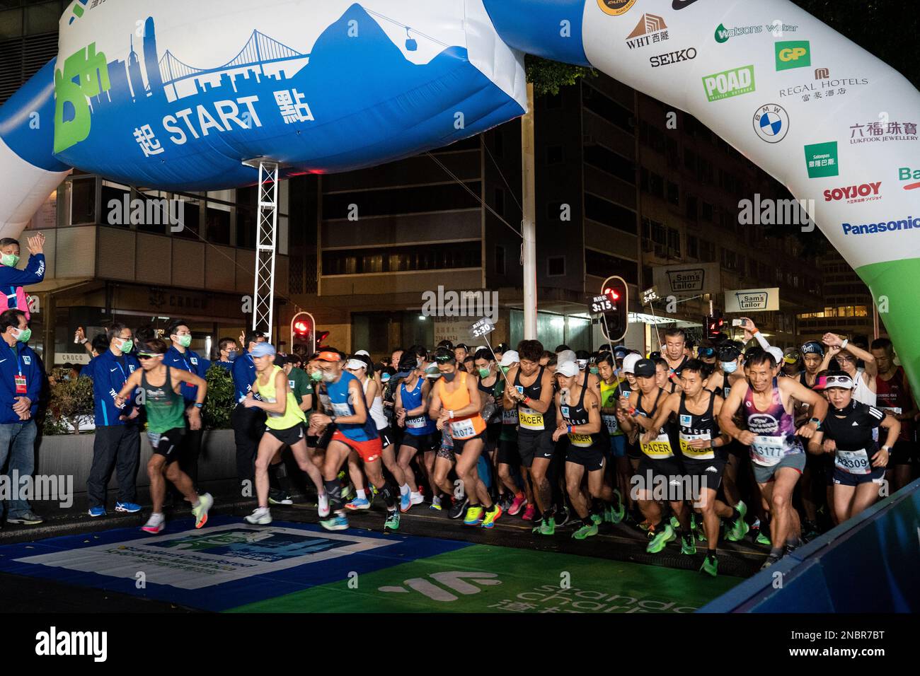 Hong Kong, China. 12th Feb, 2023. Runners seen running pass the