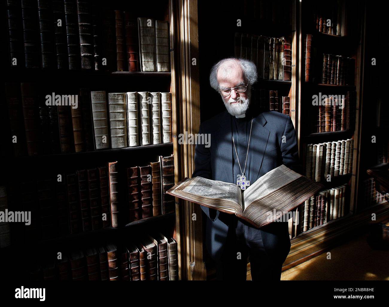 The of Canterbury Dr Rowan Williams poses for photographers with the 400 year old