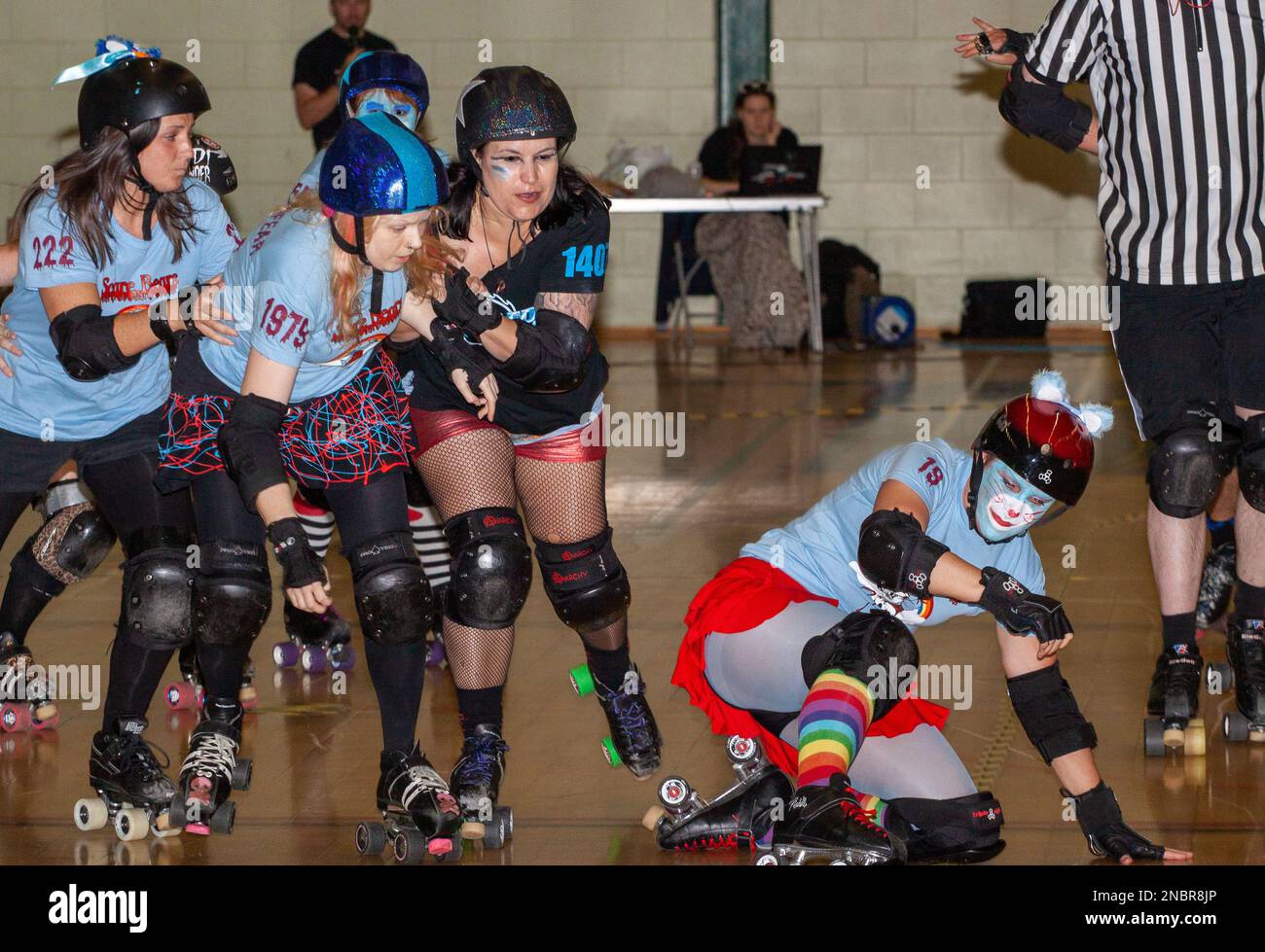 In light blue tops mixed league team Scare Bears competes in a roller derby bout at the Garon Leisure Centre Sounthend Stock Photo