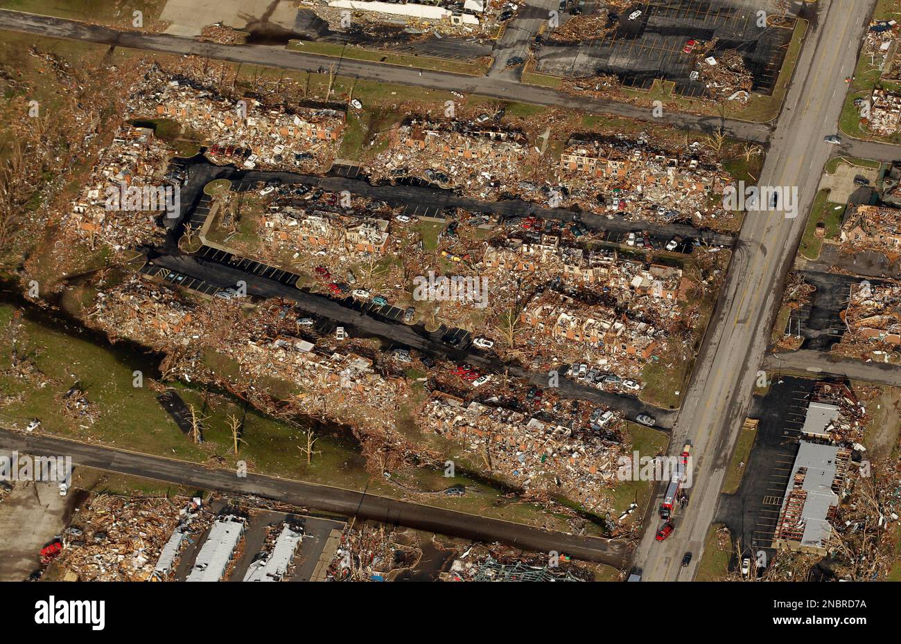 An apartment complex destroyed by a powerful tornado is seen in an