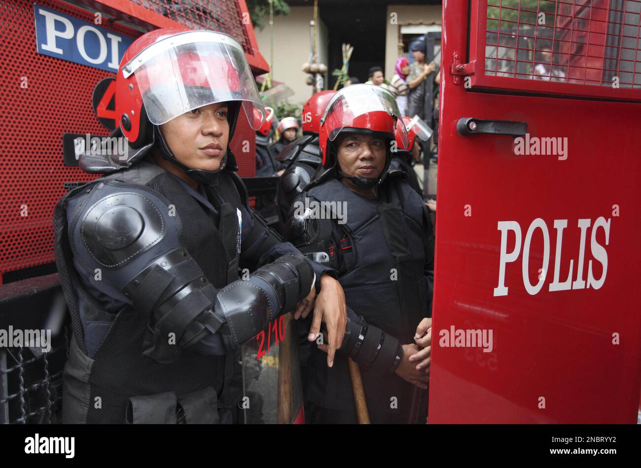 Malaysian riot police wait outside the Australian High Commission in
