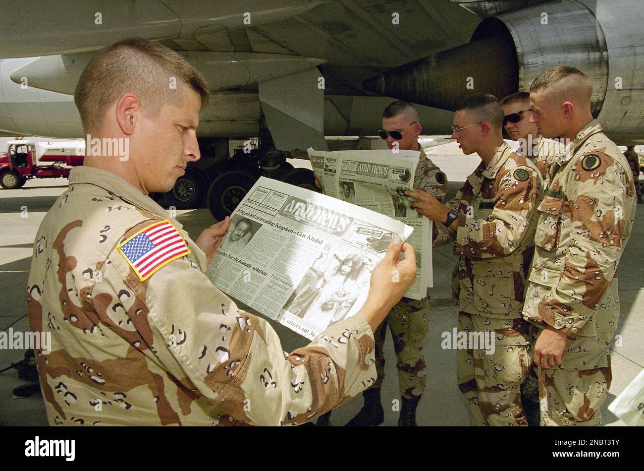 Soldiers from the 24th infantry division mechanized read copies of