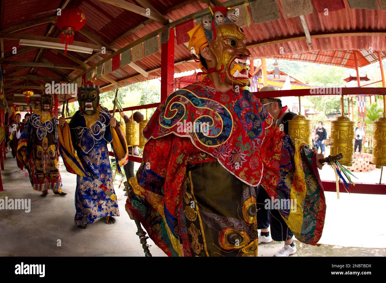 A high priest in a costume and mask performs the prayer before the Drying  Buddha ceremony at a Tibetan temple during a Wesak day celebration in Ipoh,  Malaysia, May 17, 2011. In