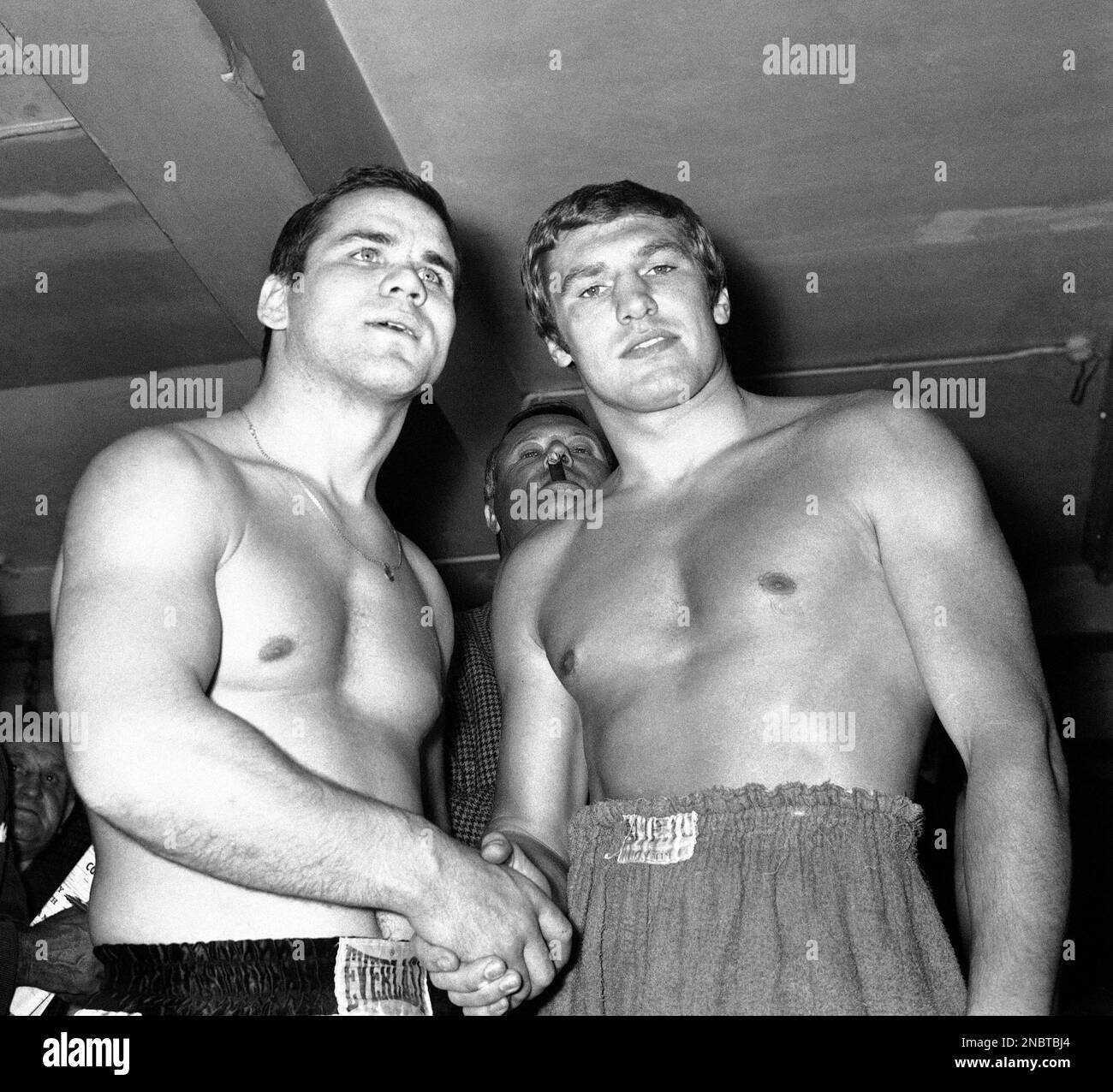 British Heavyweight Billy Walker from London, right, shakes hands with his West German opponent Horst Benedens at a gymnasium in Soho, London, on Sept