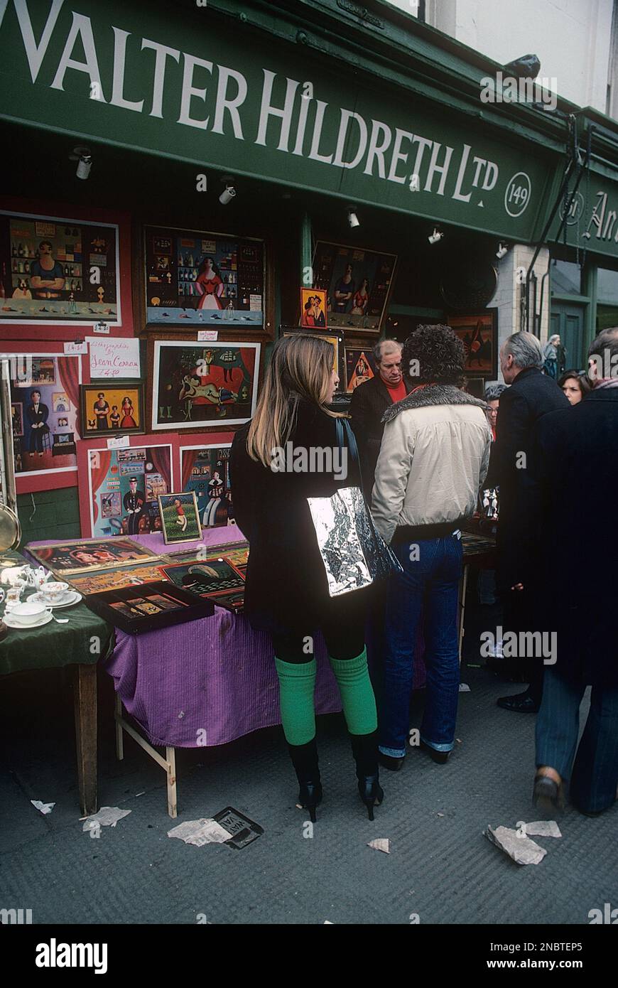 London 1977. Portobello road with it's stores and antique markets on a busy saturday. The girl is wearing the at the time popular knitted leg warmers.  Kristoffersson ref DV2 Stock Photo
