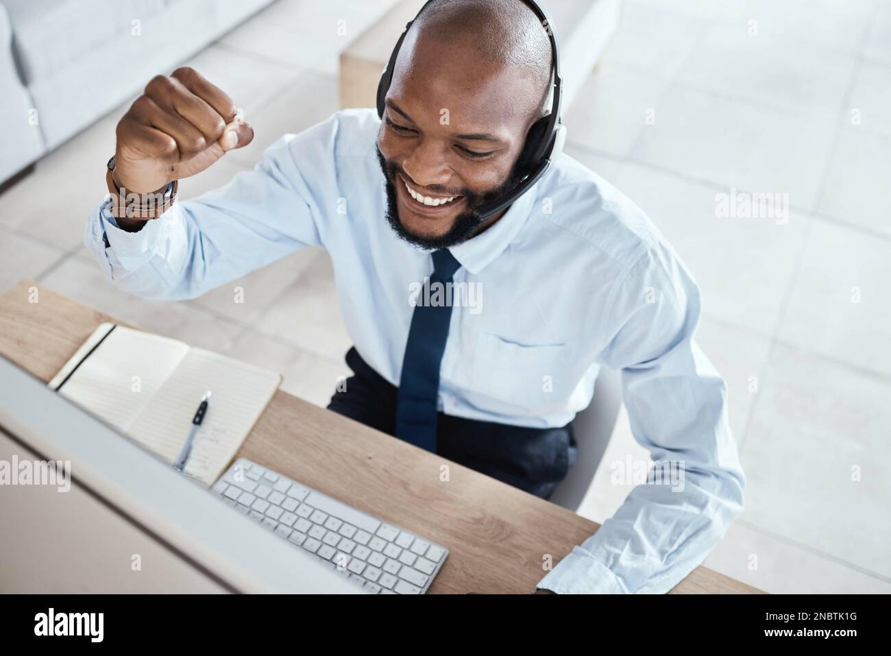 Customer service computer, consulting celebration or happy man  telemarketing on contact us CRM or African telecom. Call center fist pump,  online Stock Photo - Alamy