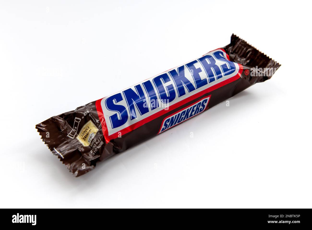 London. UK-02.12.2023. A packet of Snickers chocolate bar isolated in white. Stock Photo