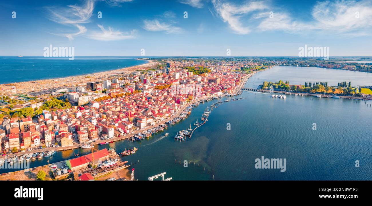 Astonishing summer view from flying drone of Sottomarina town. Aerial seascape of Adriatic sea. Captivating morning scene of Italy, Europe. Traveling Stock Photo