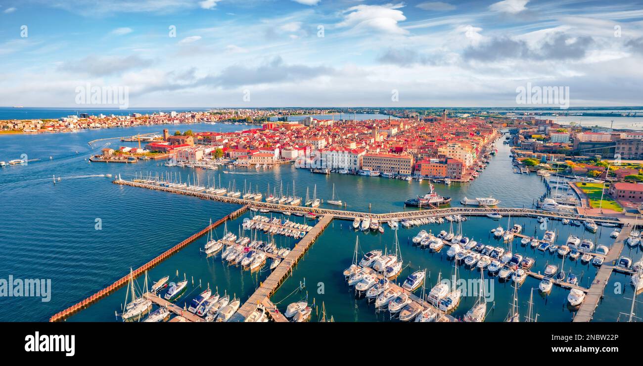 Breathtaking summer cityscape of Sottomarina port. Splendid morning seascape of Adriatic sea. Spectacular outdoor scene of Italy with luxury yachts. T Stock Photo