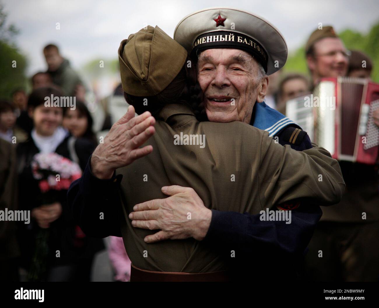 Russian World War II veteran Evgeny Ermolayev, 84, foreground right ...