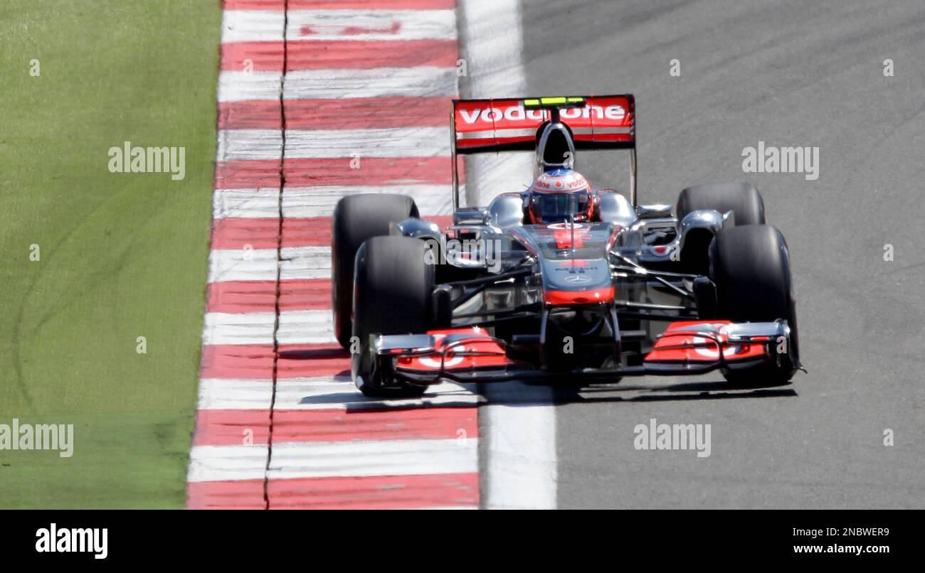 McLaren Mercedes driver Jenson Button of Britain steers his car during