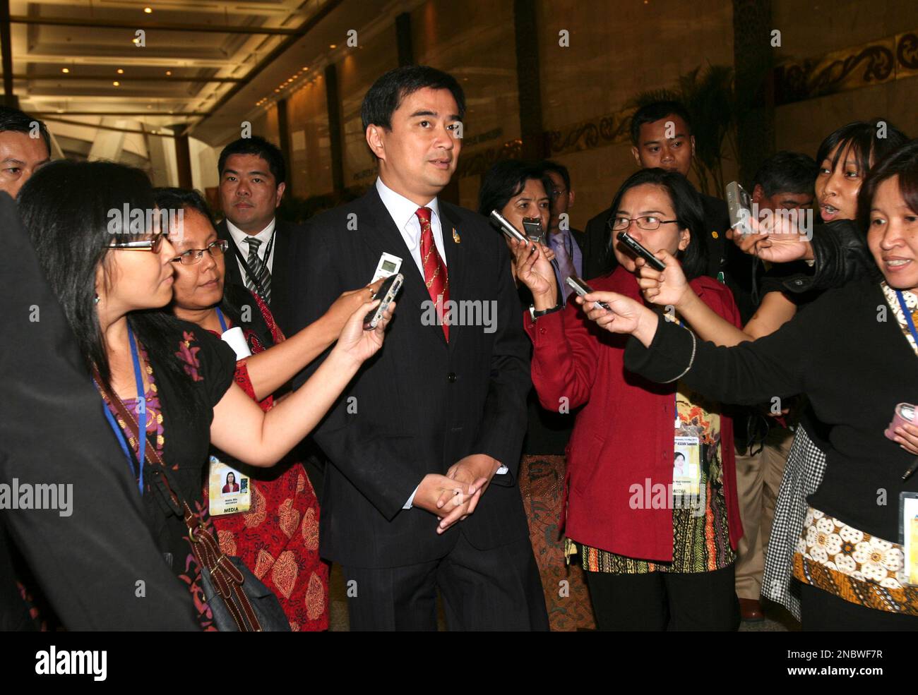 Thai Prime Minister Abhisit Vejjajiva, center, talks to the media at