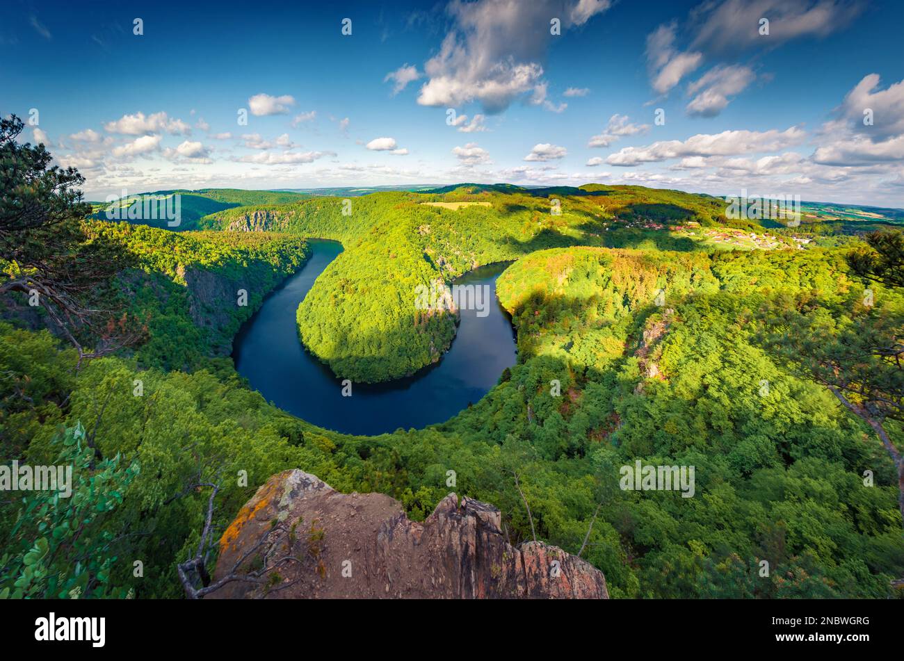 Fresh green view of Vltava river horseshoe shape meander from Maj viewpoint. Amazing summer scene of mountain canyon in Czech Republic. Beauty of natu Stock Photo