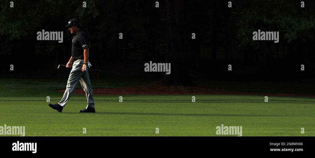 Phil Mickelson walks down the 12th fairway during the second round of