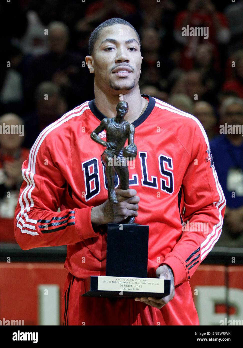 Chicago Bulls' Derrick Rose holds the Maurice Podoloff Trophy as the winner  of 2010-11 Kia NBA's Most Valuable Player before the Bulls' Game 2 of a  second-round NBA playoffs basketball series against