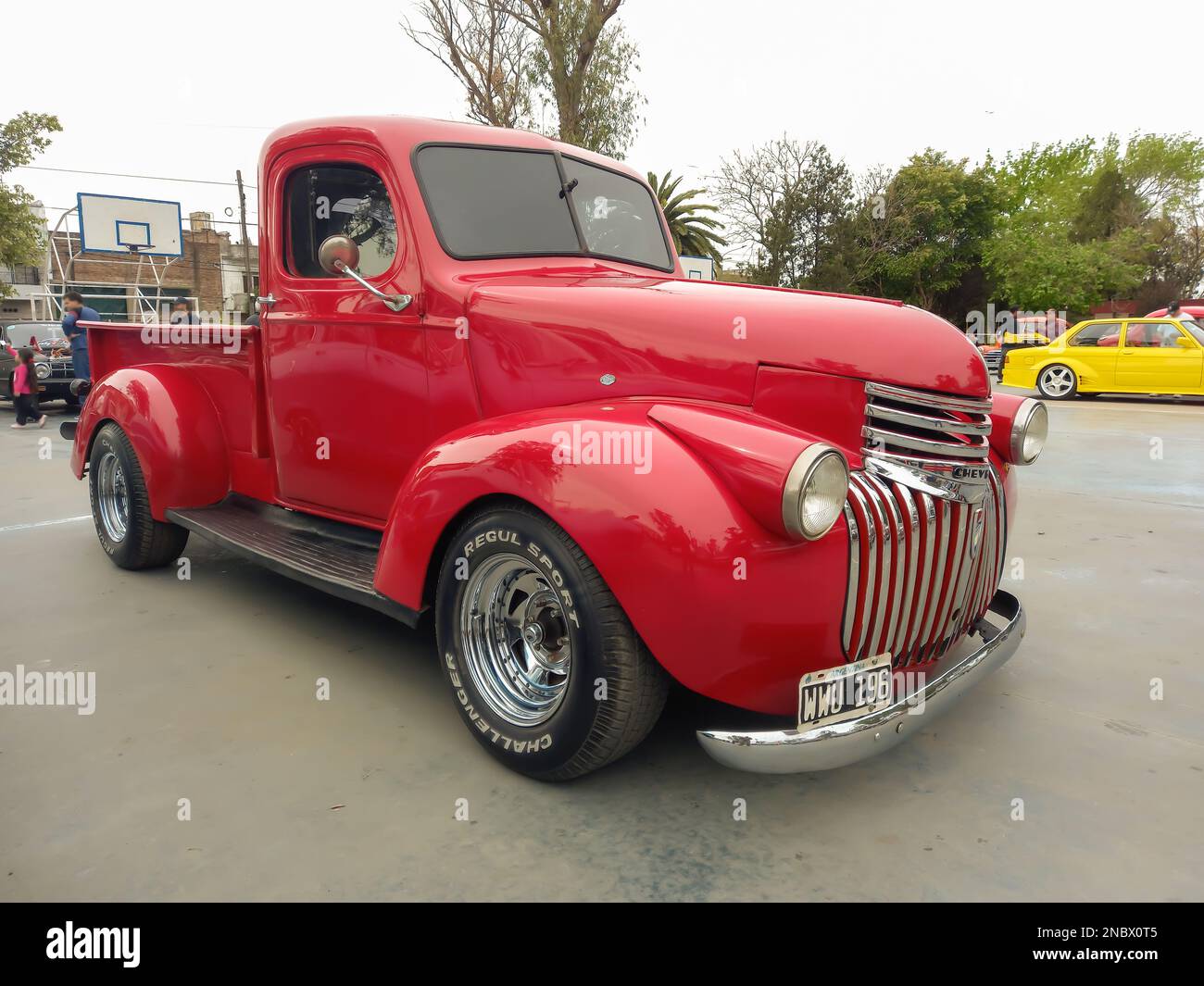 old red 1940s Chevrolet Chevy AK series pickup truck custom in a park. AAA 2022 classic car show. Stock Photo