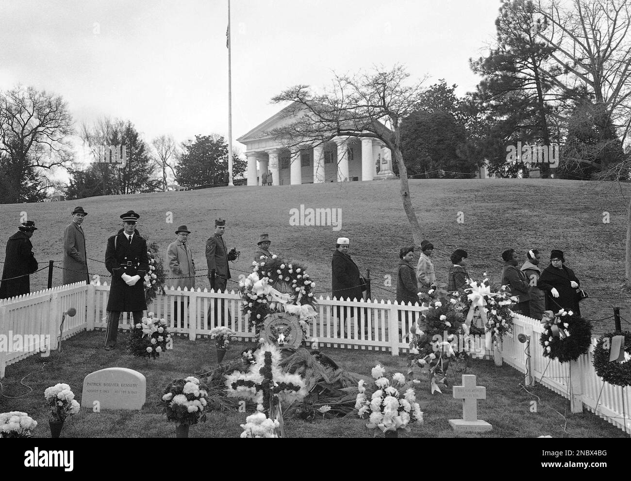 Granite headstones mark the graves of Patrick Bouvier Kennedy, left