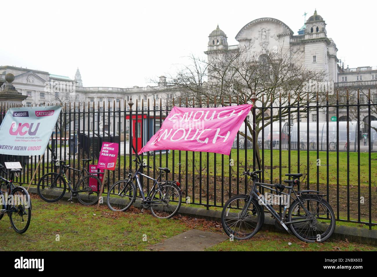 Cardiff University, Wales. February 14th 2023. A banner tied to railings outside Main Building.  Academics and senior professional services staff hold a strike rally in support of fair pay outside Cardiff University, Wales. February 14th 2023.  Credit Penallta Photographics / Alamy Live Stock Photo