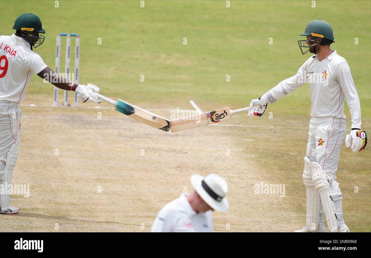 Zimbabwean batsman Innocent Kaia,left, and Craig Ervine touch bats on