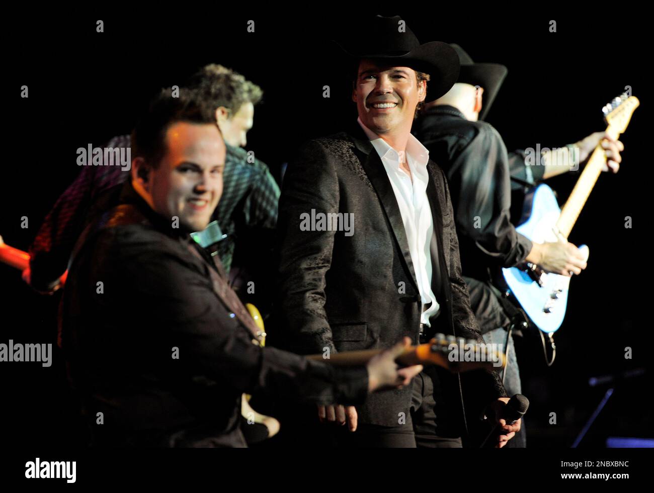 Country singer Clay Walker, second from right, performs with his band