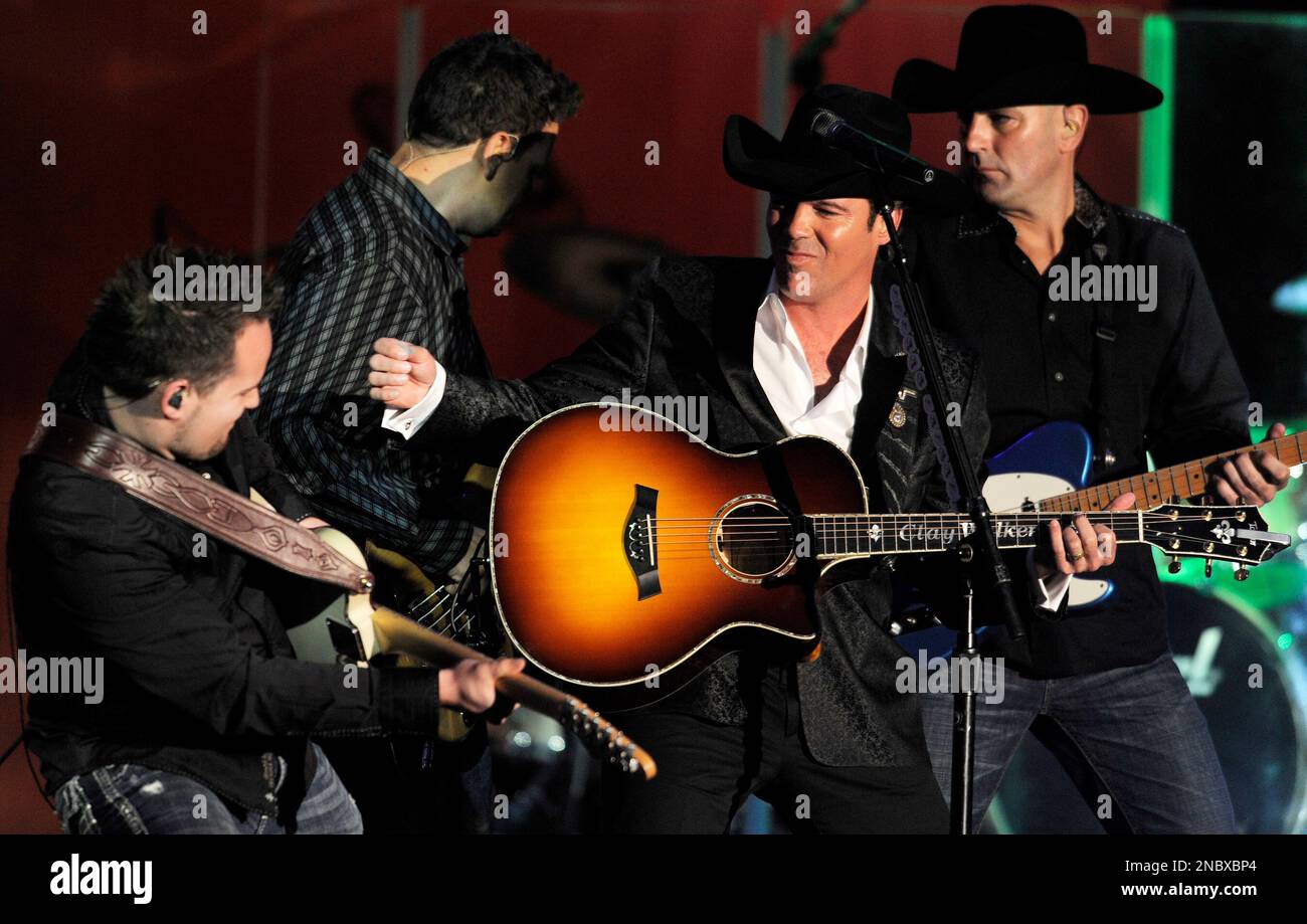 Country singer Clay Walker, second from right, performs with his band ...