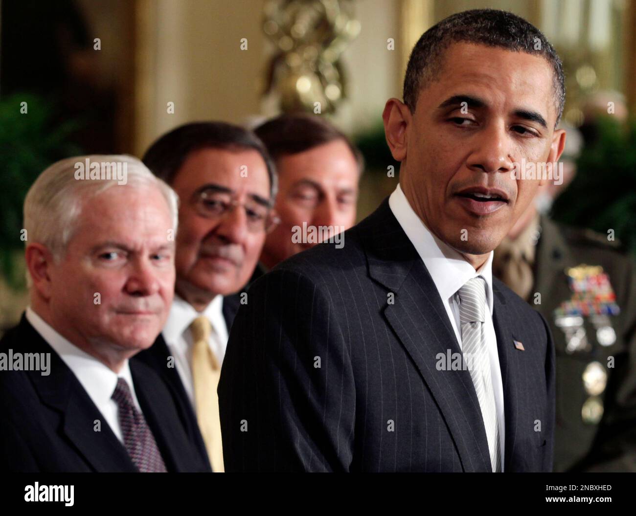 President Barack Obama, right, speaks as outgoing Defense Secretary ...