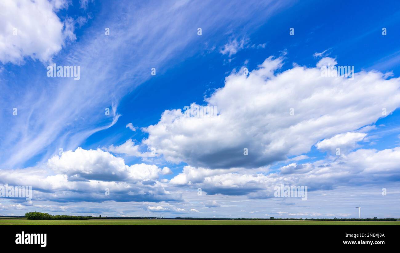Bright blue skies over a distant narrow stretch of land in Germany's