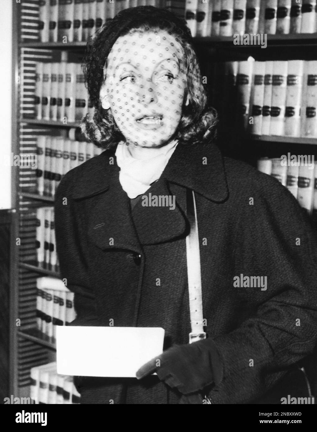 Swedish born actress Greta Garbo holds papers in her hand in Los