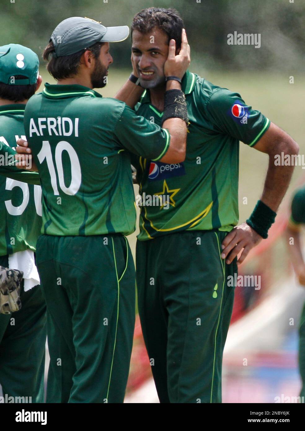 Captain Riaz Pakistan's captain Shahid Afridi congratulates Wahab Riaz after he took ...