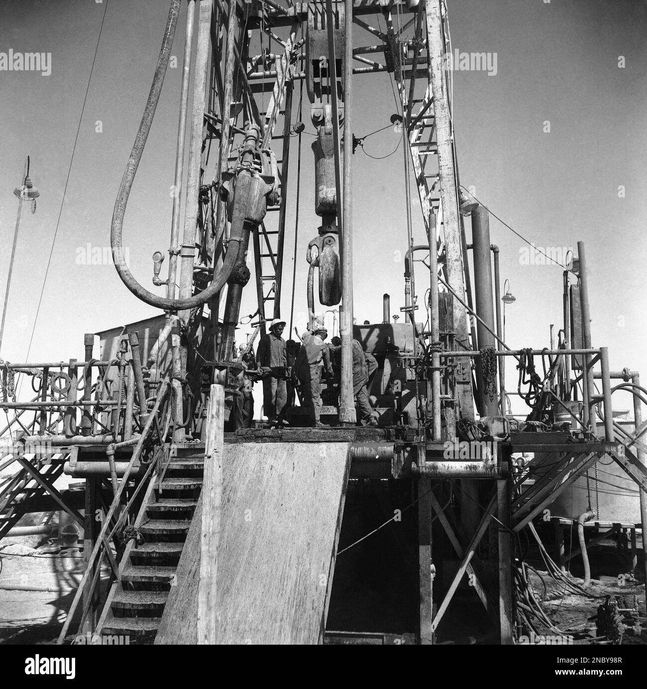 One of the last stages in drilling the first oil well in Kuwait on