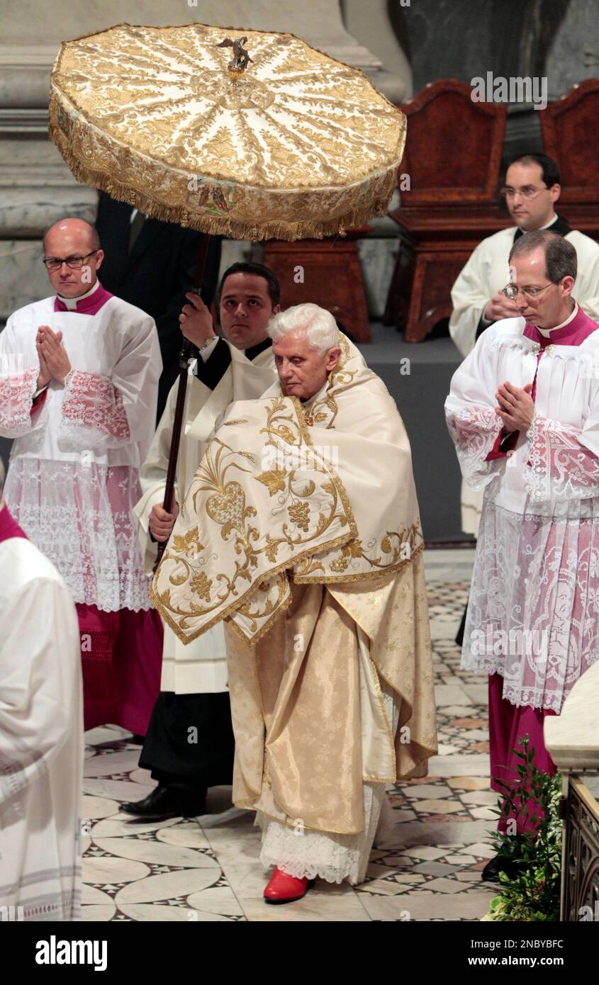 Pope Benedict XVI leaves following the Holy Thursday rite of the ...
