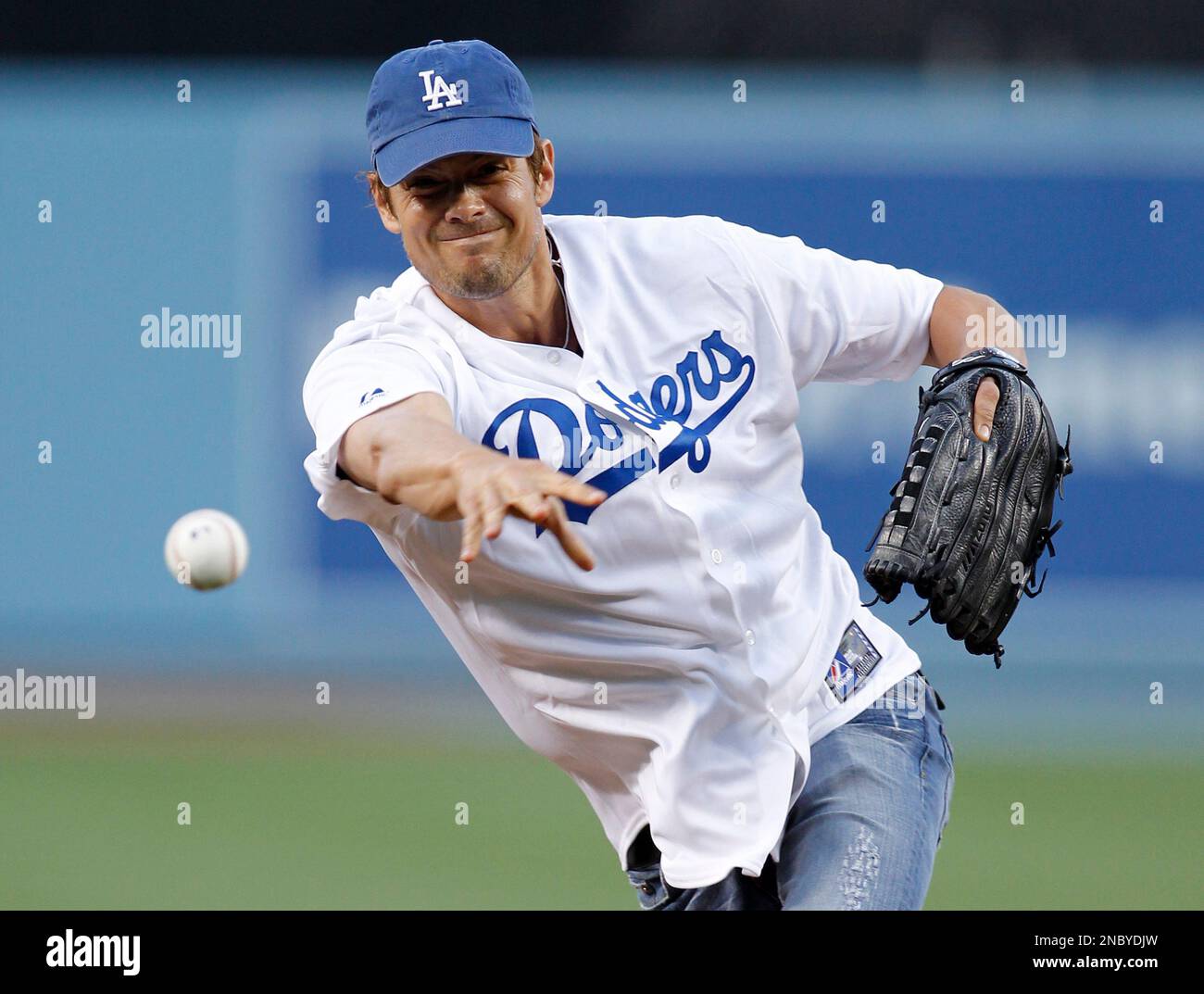 Actor Josh Duhamel throws out the first pitch at Dodger Stadium before