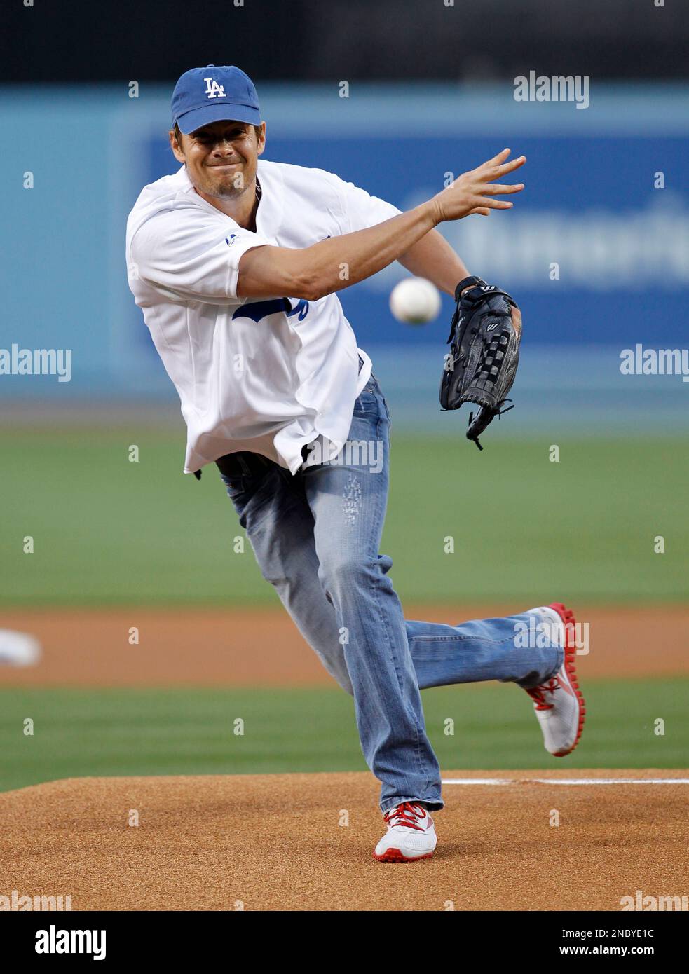 Actor Josh Duhamel throws out the first pitch at Dodger Stadium before