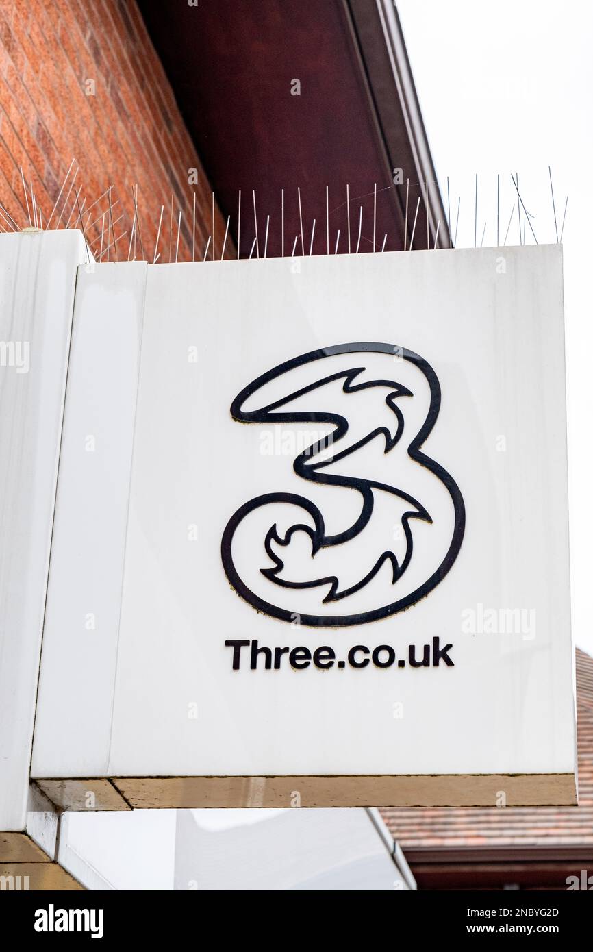 3 Mobile phone network sign on outside wall UK Stock Photo