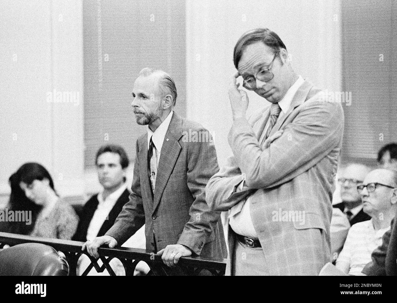 Bob Spittler, left, an organizer of the Aryan Woodstock identifies himself  in Napa County Superior Court in Napa, Calif., March 2, 1989 as Napa County  Counsel Robert Westmeyer scratches his head. In