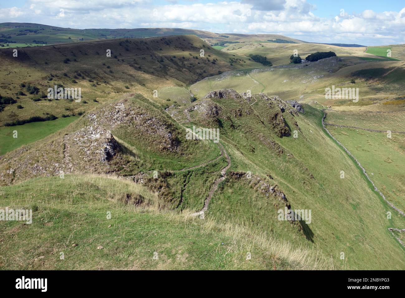 The Path over the Lumps & Bumps on the Dragons Back Ridge from the Summit of Chrome Hill in the Dove Valley, Peak District National Park, England, UK. Stock Photo