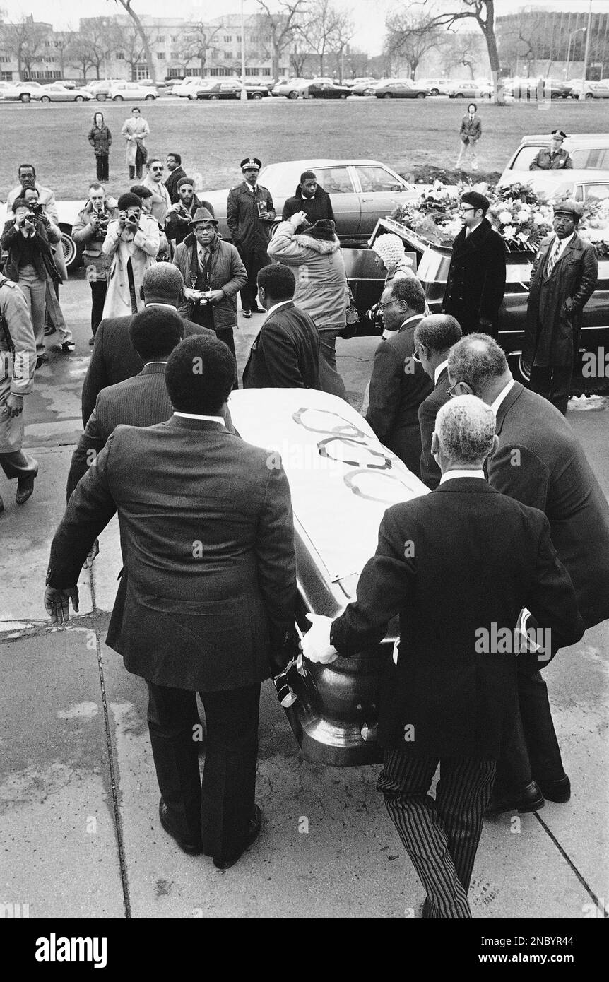 Pallbearers, all former U.S. Olympians, carry coffin containing remains of Jesse  Owens to hearse after funeral service in Chicago on April 4, 1980. Owens,  winner of four gold medals in the 1936