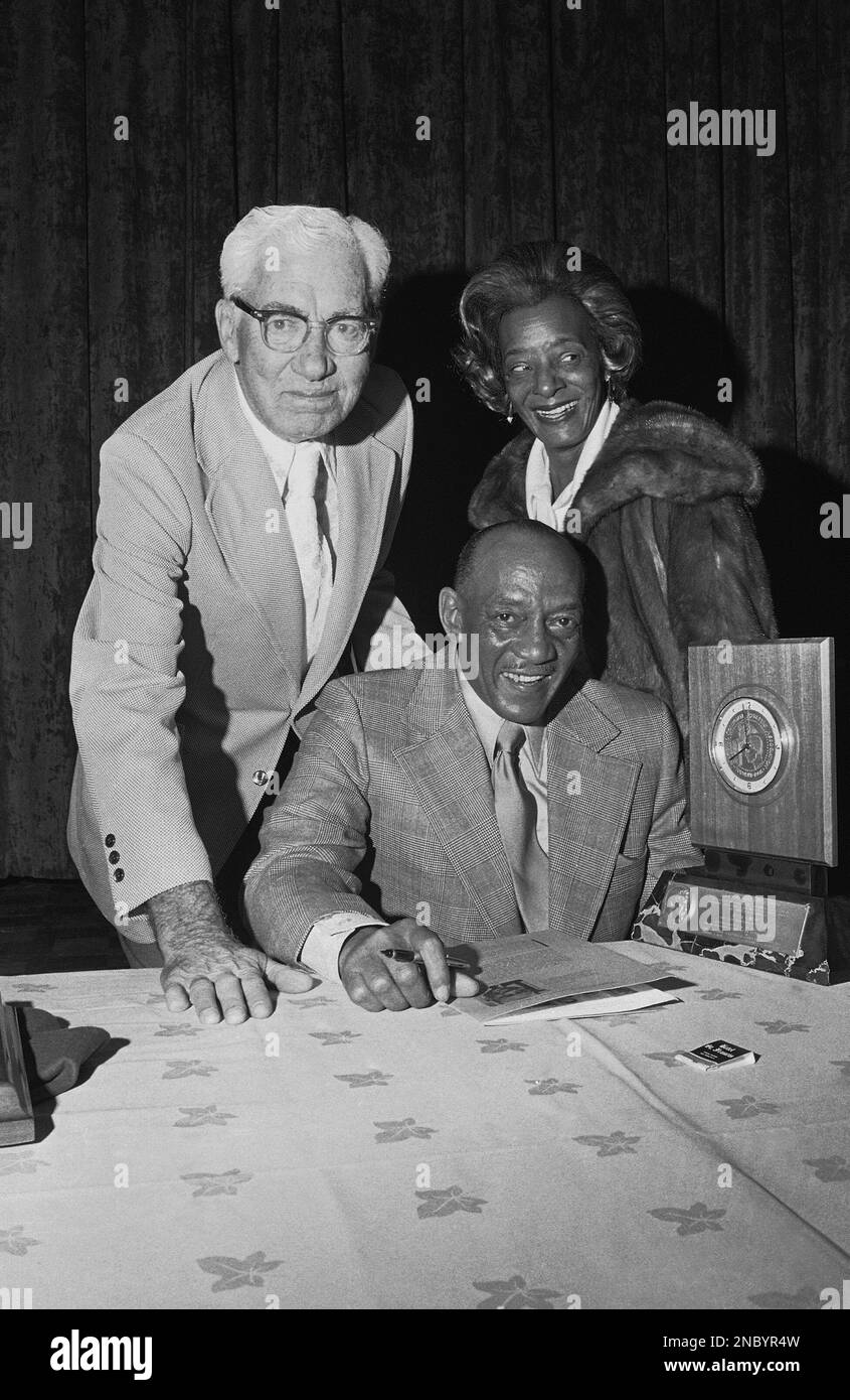 Jesse Owens, seated, former Ohio State track star who was the hero of