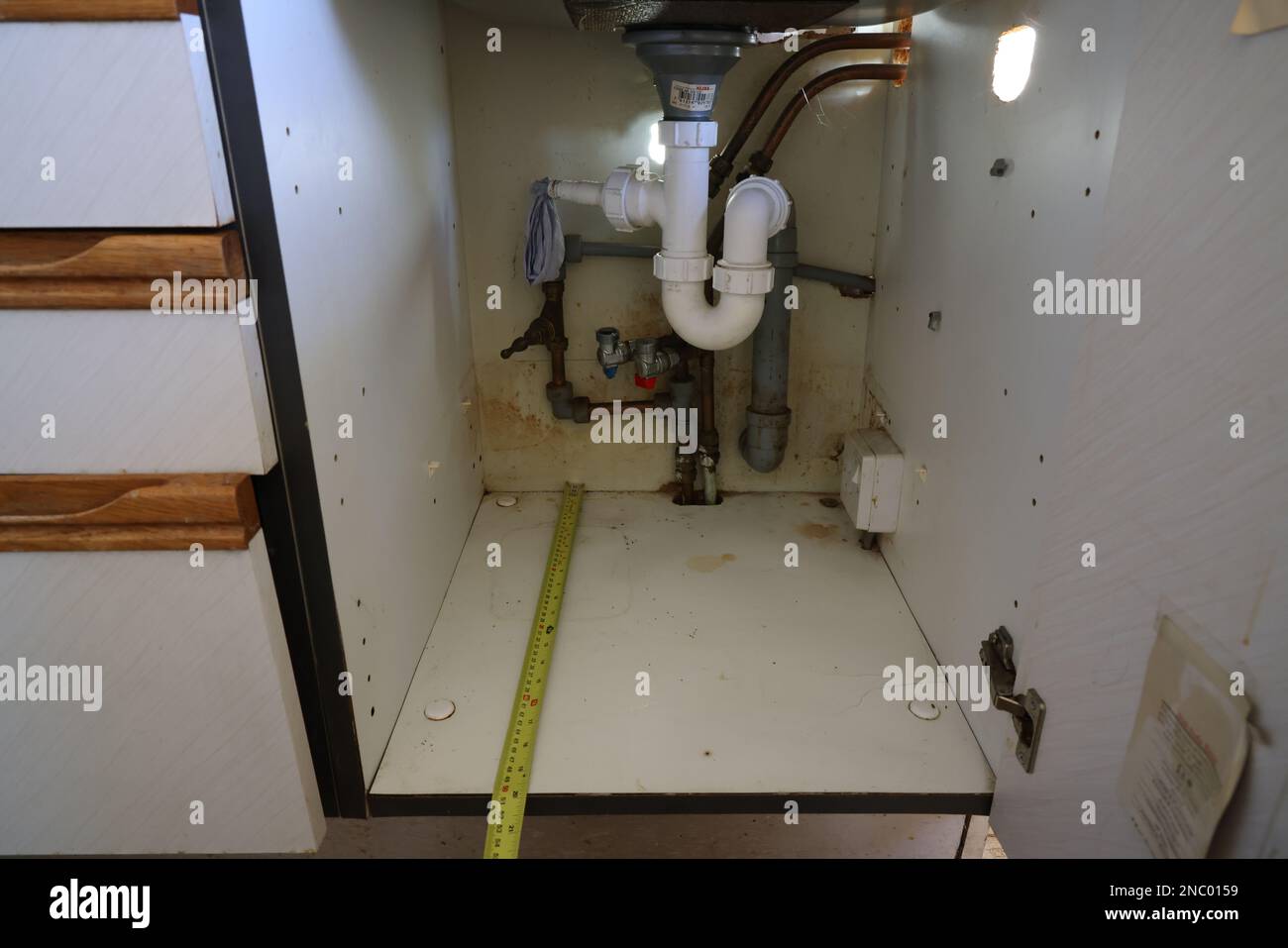messy cupboard under sink Stock Photo Alamy