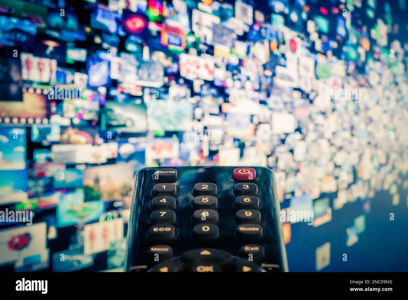 Video on demand (VoD) screen with remote control in foreground Stock Photo