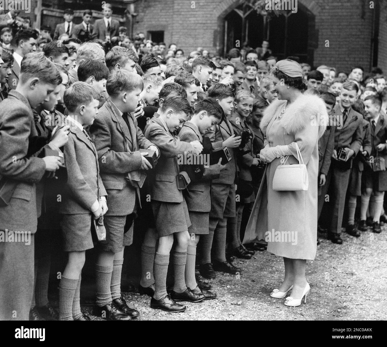 Her Majesty the Queen Mother chats with boys of Berkhamsted School