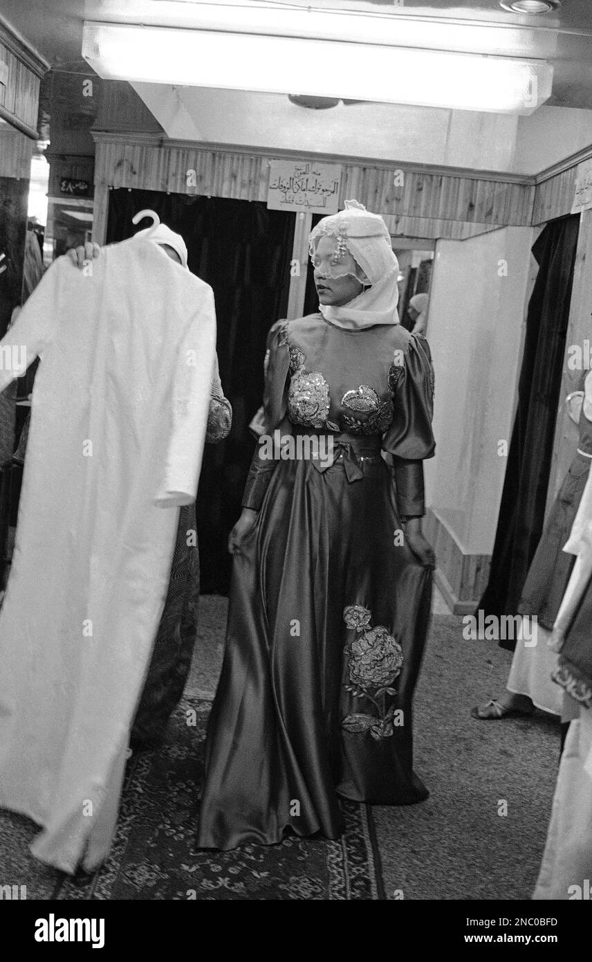 A model fashions an evening gown at El Salam Shopping Center, an Islamic  dress shop in Cairo, Egypt on Feb. 6, 1986 which offers chic designs in  clothing for Islamic women who
