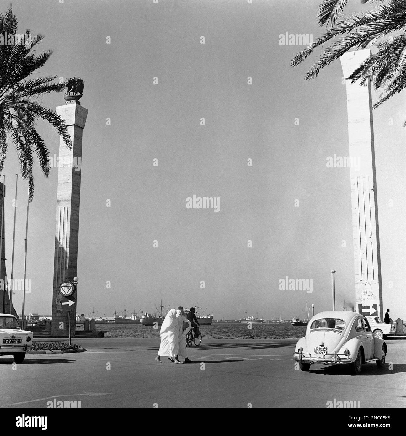 Libyan women in shroud like “barracans” walk across the street in
