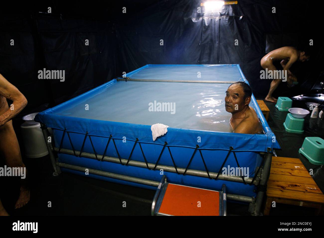 Evacuees take a bath at the evacuation center set up at the Big Palette Fukushima sports arena