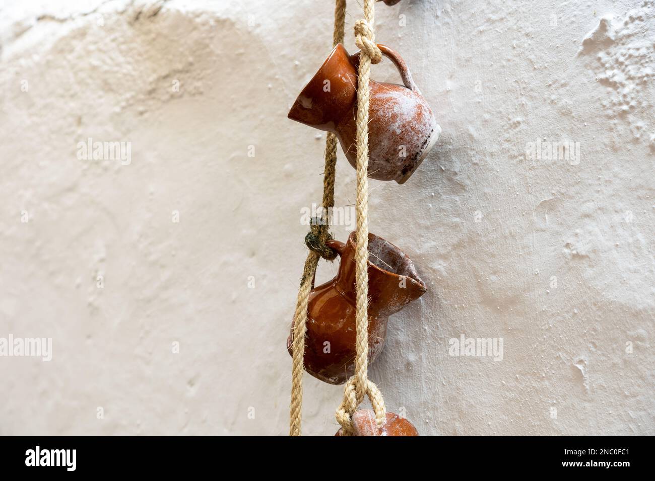 Pots hanging on a rope hi-res stock photography and images - Alamy