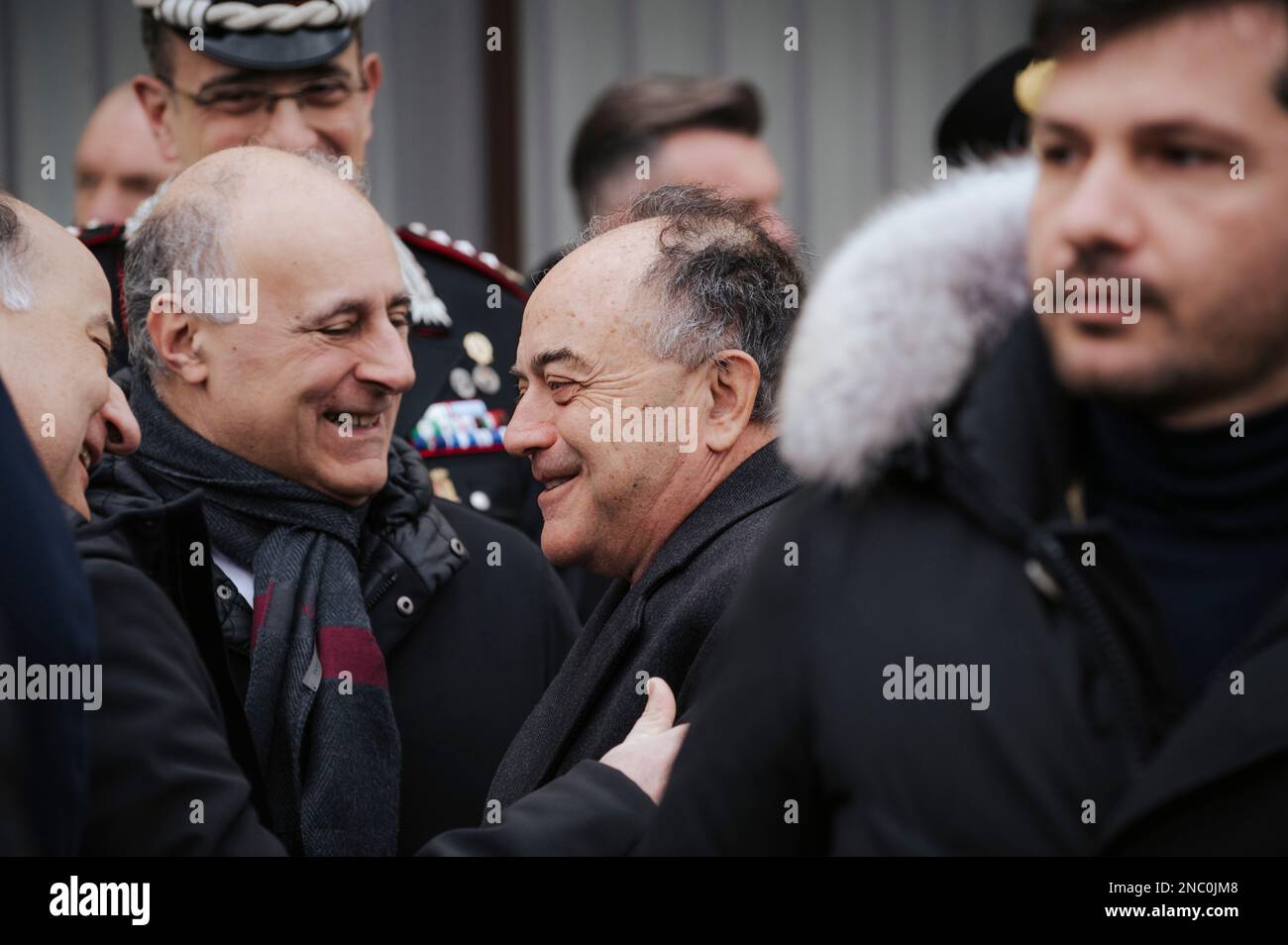 Catanzaro, Italy. 13th Feb, 2023. Nicola Gratteri(C), anti-mafia Public Prosecutor, seen greetings colleagues. Minister Piantedosi (C) seen talking among authorities. The Italian Minister of Interior Matteo Piantedosi attended the inauguration of the operative Anti-mafia Investigation Department (DIA - Direzione Investigativa Antimafia) The Minister also attended the provincial meeting for order and public security and the signature for a protocol for re-usage of buildings and assets seized from organise crime. Credit: SOPA Images Limited/Alamy Live News Stock Photo