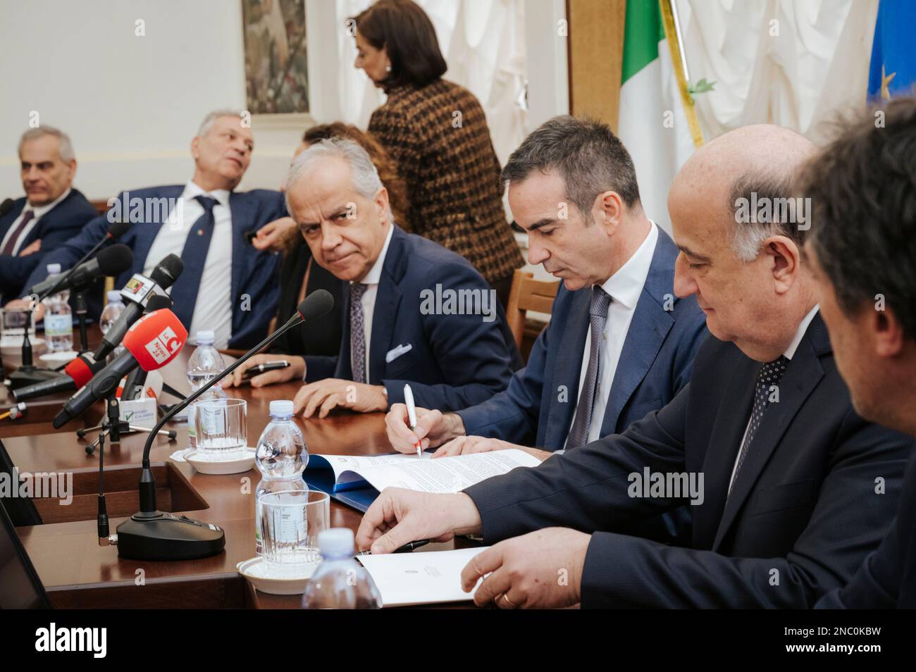 Catanzaro, Italy. 13th Feb, 2023. Roberto Occhiuto (C-R), Regional Governor, seen signing the protocol. The Italian Minister of Interior Matteo Piantedosi attended the inauguration of the operative Anti-mafia Investigation Department (DIA - Direzione Investigativa Antimafia) The Minister also attended the provincial meeting for order and public security and the signature for a protocol for re-usage of buildings and assets seized from organise crime. Credit: SOPA Images Limited/Alamy Live News Stock Photo