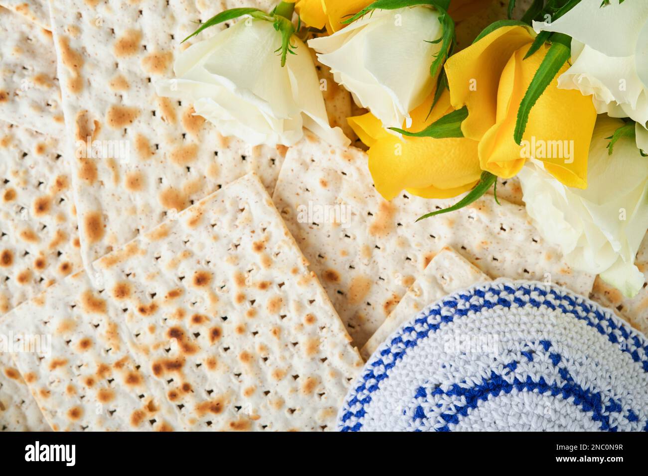 Passover celebration concept. Matzah, red kosher, white and yellow
